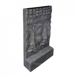 Escultura de piedra con doble rostro